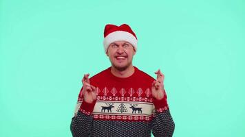 Man in Christmas sweater wish for good luck rejoices about receive long-awaited gift box celebration video