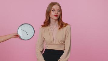 Confused woman with anxiety checking time on clock, running late to work, being in delay, deadline video