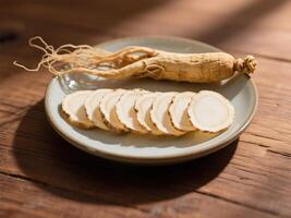 Ginseng roots on a white plate placed on a rustic wooden table photo