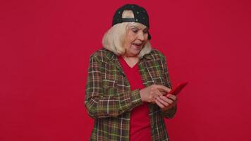 Happy excited woman use mobile phone say wow yes found out great big win news doing winner gesture video