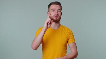 Handsome adult man pointing to camera and looking with playful happy expression, making choice video