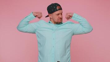 Man showing biceps and looking confident, feeling power strength to fight for rights, success win video