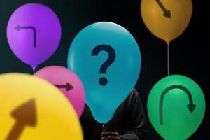 Economic uncertainty symbolized by arrows and a question mark on Balloon, reflecting volatility and lack of clear direction photo