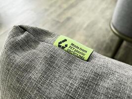 Eco-friendly textile product with a clear upcycling label, promoting sustainable practices and circular economy in modern consumer goods photo