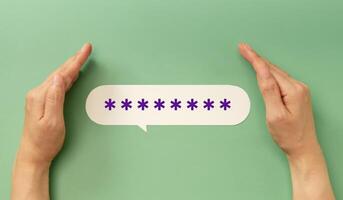 Hands protecting a hidden password speech bubble symbolizing online security and privacy in digital communication photo