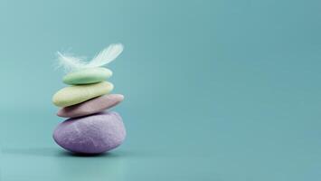 Calm and stable mindset represented by balanced colorful stones and feather, symbolizing inner peace and emotional steadiness photo