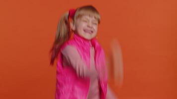 Stylish girl in blouse shouting, raising fists in gesture I did it, celebrating success, winning video