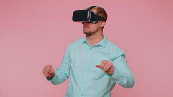 Man using virtual reality futuristic technology VR headset helmet to play simulation 3D game video