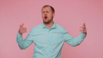 Funny man listening music, smiling dancing to disco party music rhythmically moving hands having fun video