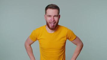 Funny showing tongue making faces at camera, fooling around, joking, aping with silly face, teasing video