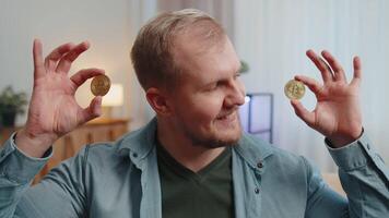 Guy stock trader earning bitcoins after online monitoring trading operations mining hold BTC coins video