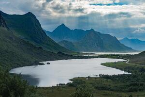 Cloudy valley with lakes and road view from Nappskaret viewpoint, Lofoten Norway photo