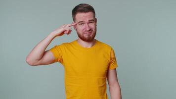 Tourist man pointing at camera and showing stupid gesture blaming some idiot for insane plan video