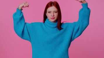 Girl showing biceps, feeling power strength to fight for rights, energy to gain success win fight video
