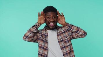 Funny joyful man making playful silly facial expressions, grimacing, fooling around showing tongue video