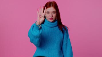Countdown to win celebration cheerful girl 20s in sweater counting in reverse order from five to one video