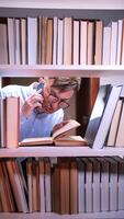 vertical University student having an angry phone conversation while trying to study in a library, surrounded by stacks of books and feeling overwhelmed by frustration and stress video