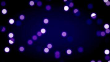 Purple neon orbs float and fall across the screen, creating a dreamy, magical effect of particles in soft glowing motion. video