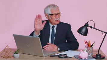 Senior businessman say no hold palm hand in stop gesture, warning of finish prohibited access danger video