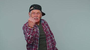 Aggressive angry man trying to fight at camera, shaking fist, boxing with expression, punishment video