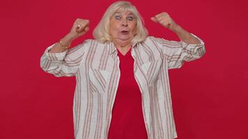 Woman showing biceps and looking confident, feeling power strength to fight for rights, success win video