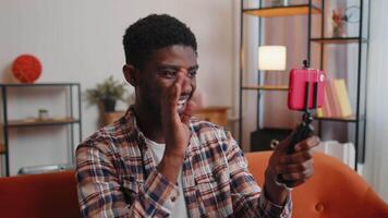 Man blogger influencer taking selfie on smartphone, make virtual social media online at home video