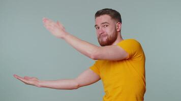 Man pointing empty place, advertising area for commercial text, copy space for goods promotion video