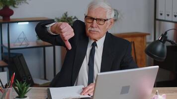 Upset senior business man showing thumbs down sign gesture, disapproval, dissatisfied, dislike video