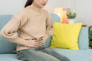 stomach ache. have abdominal pain, indigestion, gastritis, menstrual cramps, flatulence, diarrhea, distention, colon cancer, belly inflammation problem, suffer food poisoning, abdomen photo