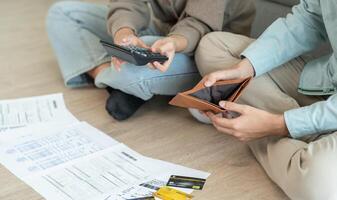 Stressed and headache couple with large bills or invoices no money to pay to expenses and business problem. shortage, Financial problems, mortgage, loan, bankruptcy, bankrupt photo
