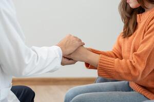 psychiatrist hold hand support each while discussing family issues, doctor encourages and empathy woman suffers depression. psychological, save divorce, Hand in hand together, trust, care photo