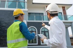 inspector engineers and owner project is inspecting construction and quality assurance new house. Engineers or architects or contactor work to build the house. photo