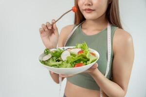 women choose healthy foods, dieting female choose salad for diet. Good healthy food. weight lose, balance, control, reduce fat, low calories, routines, exercise, body shape. photo