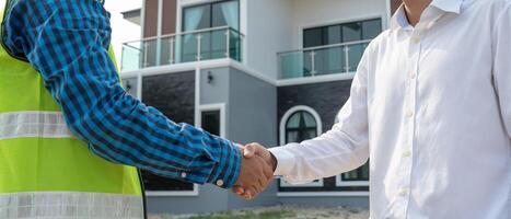 Engineer team hands shaking greet start up plan new project contract in office center at construction site, industry ,architecture, partner, teamwork, agreement, property, contacts. photo