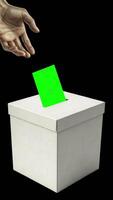 Voting process in a polling station with a hand casting a ballot into a ballot box video