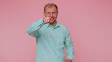 Man smiling excitedly and pointing to camera choosing lucky lottery winner indicating to awesome you. video