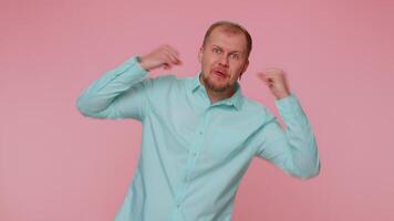 Bearded man smiling friendly at camera and waving hands gesturing hello or goodbye, welcoming. video