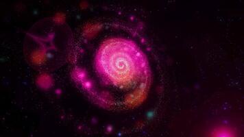 A bright, fiery pink, three-dimensional spiral galaxy quickly and spectacularly changes position, appearing before us in beautiful, unexpected angles. video