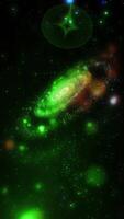 A bright, green, three-dimensional spiral galaxy quickly and dynamically changes position, appearing before us in beautiful, unexpected angles. video