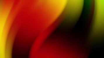 An abstract background inspired by the colors of Juneteenth, featuring flowing gradients of red, yellow, green, and black. This vibrant design symbolizes freedom, heritage, and unity video