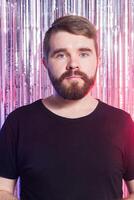 Sad man against shiny background. photo