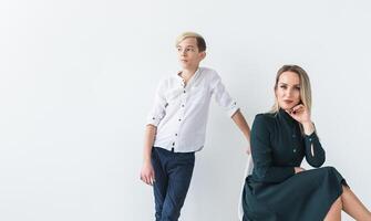 Parenting, family and single parent concept - A happy mother and teen son smiling on white background with copy space. photo