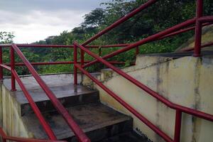 Concrete Stairs with Red Handrails After Rain photo