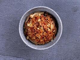 a bowl of food with nuts and other ingredients photo