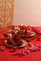 a table with two plates of food and a plate of chopsticks photo