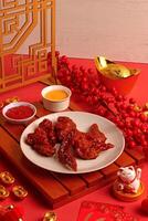 a plate of food on a table with a chinese lantern photo