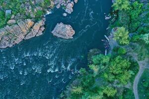 Aerial view of the winning rowers disembarking from boat races on the river photo