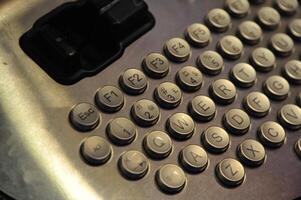 Close-up of a Metallic Keyboard with Round Keys photo