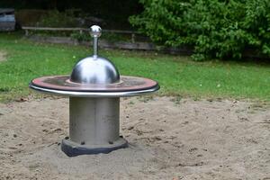 Metallic Spinning Top in Playground photo