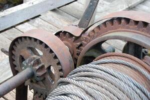 Rusty Mechanical Winch with Gears and Cable photo